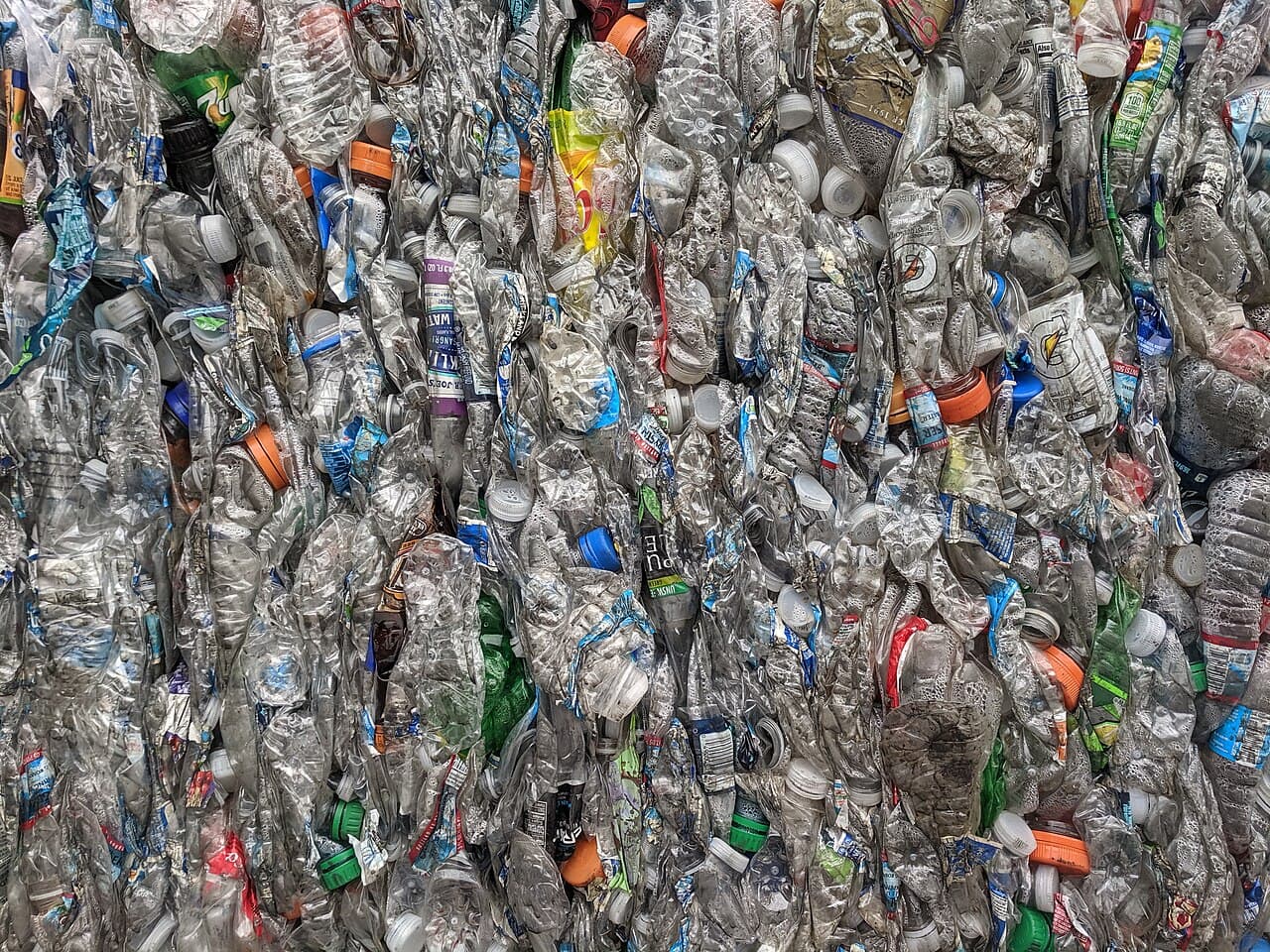 Baled post-consumer PET bottles awaiting conversion